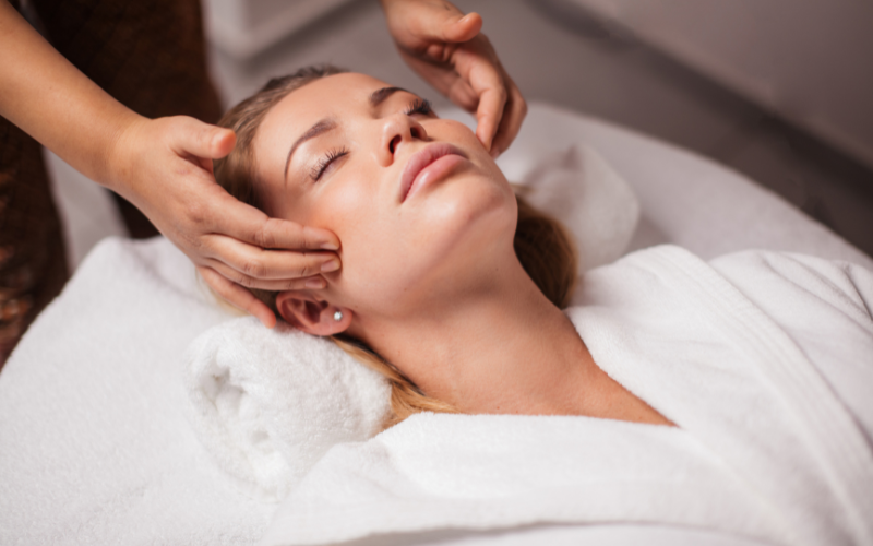 Close-up of a relaxing anti-aging facial treatment being delivered to a client at home or in a hotel room by Lumi Glow Bangkok massage delivery.
